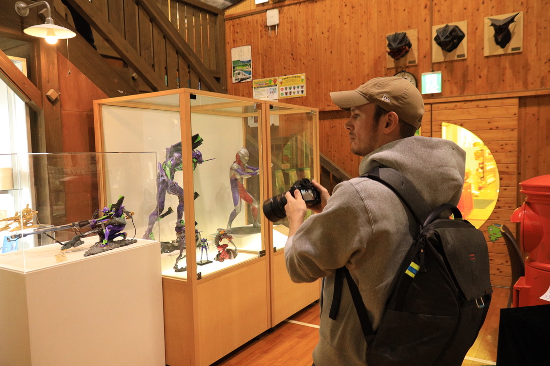 Display case with Star Wars Darth Vader Boba Fett DeLorean Jack Sparrow figures at Kaiyodo Museum