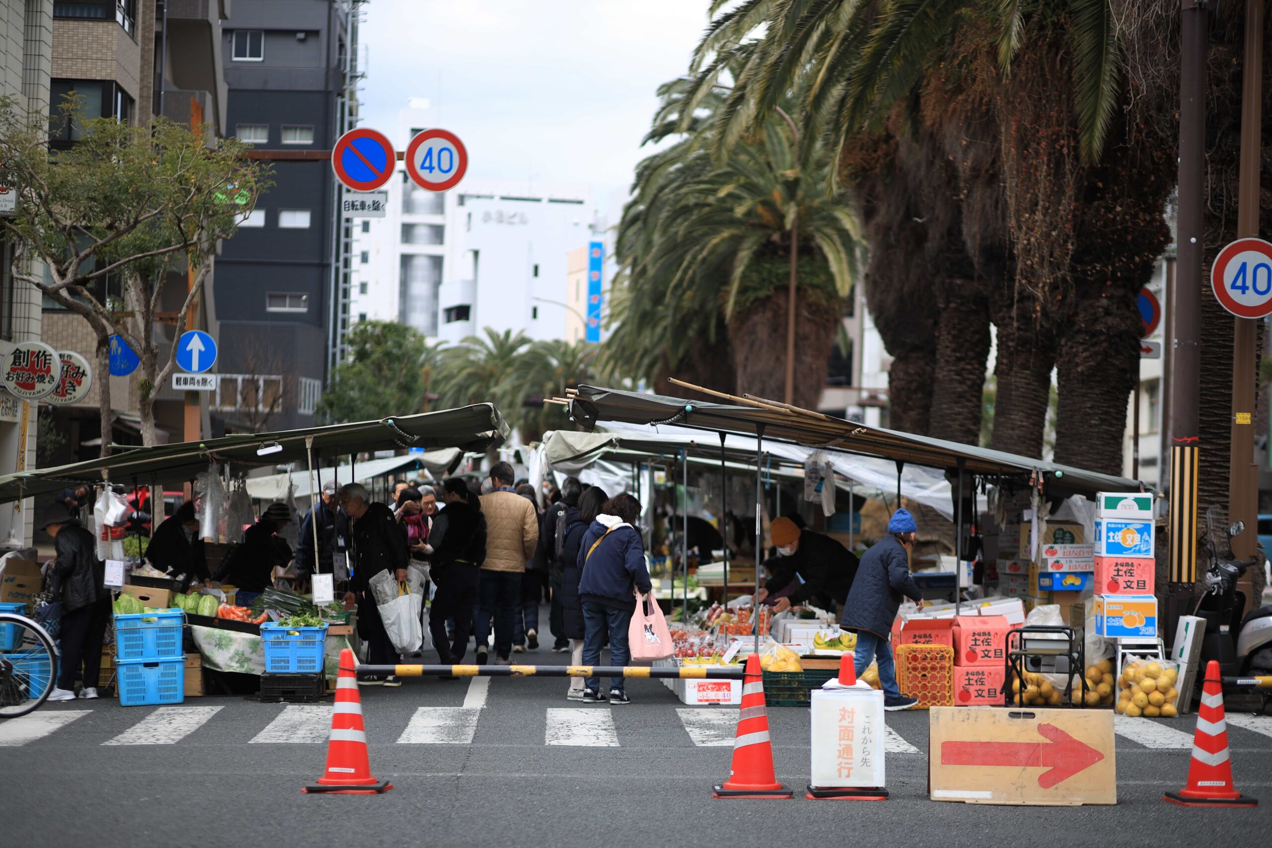 Vendor and customer at roadside vegetable stall at Kochi Sunday Market