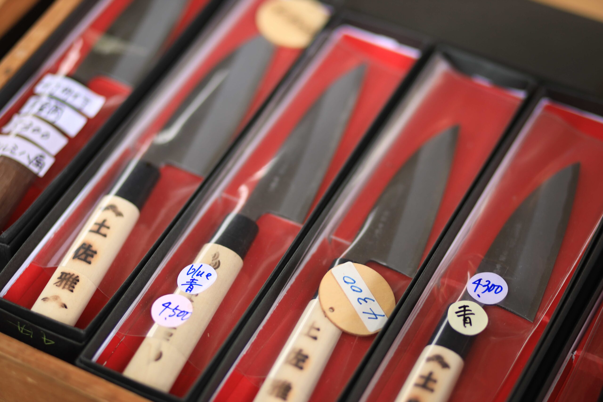Fresh daikon radishes, carrots and turnips at a produce stall at Kochi Sunday Market