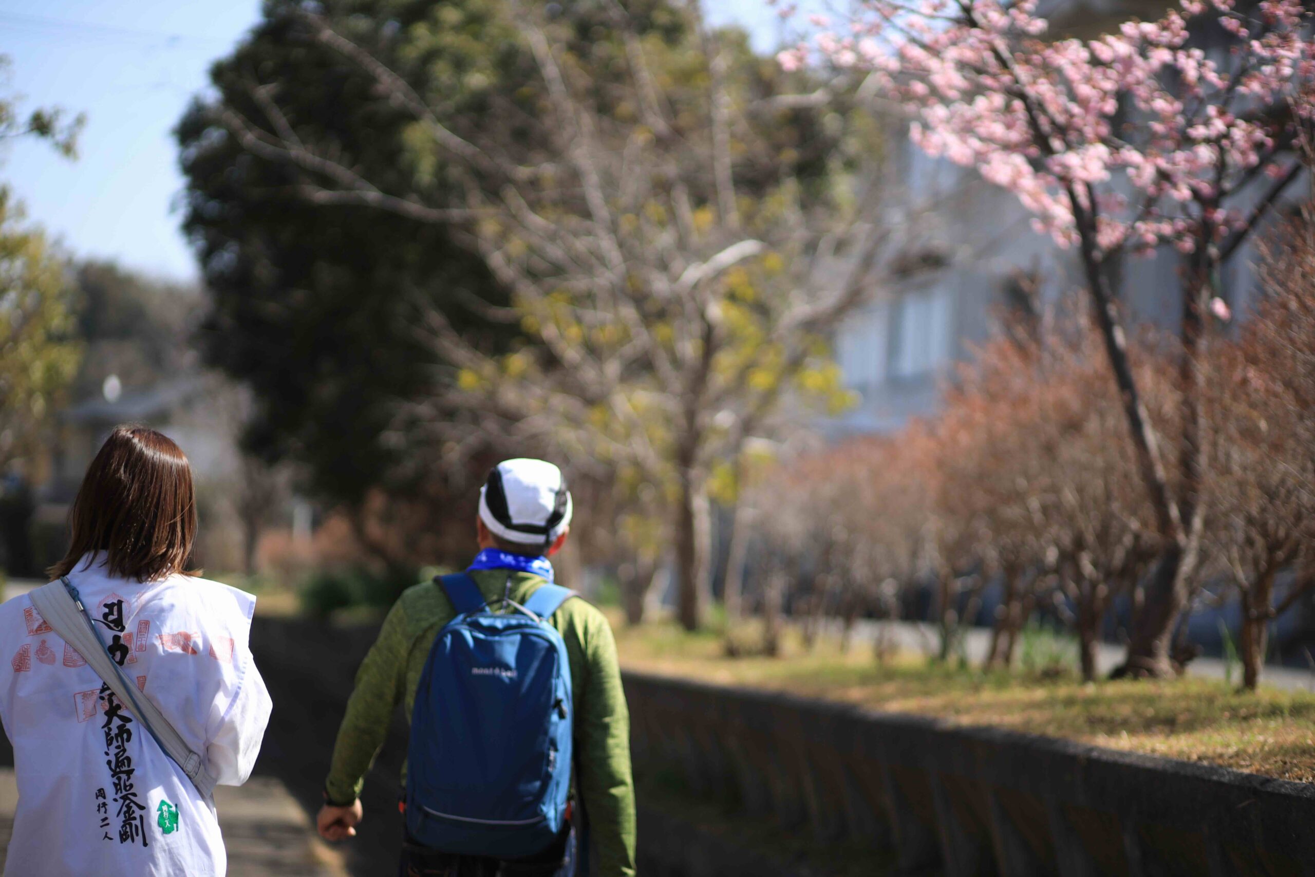Feet walking on ancient moss-covered stone path of the Shikoku Pilgrimage in Kochi