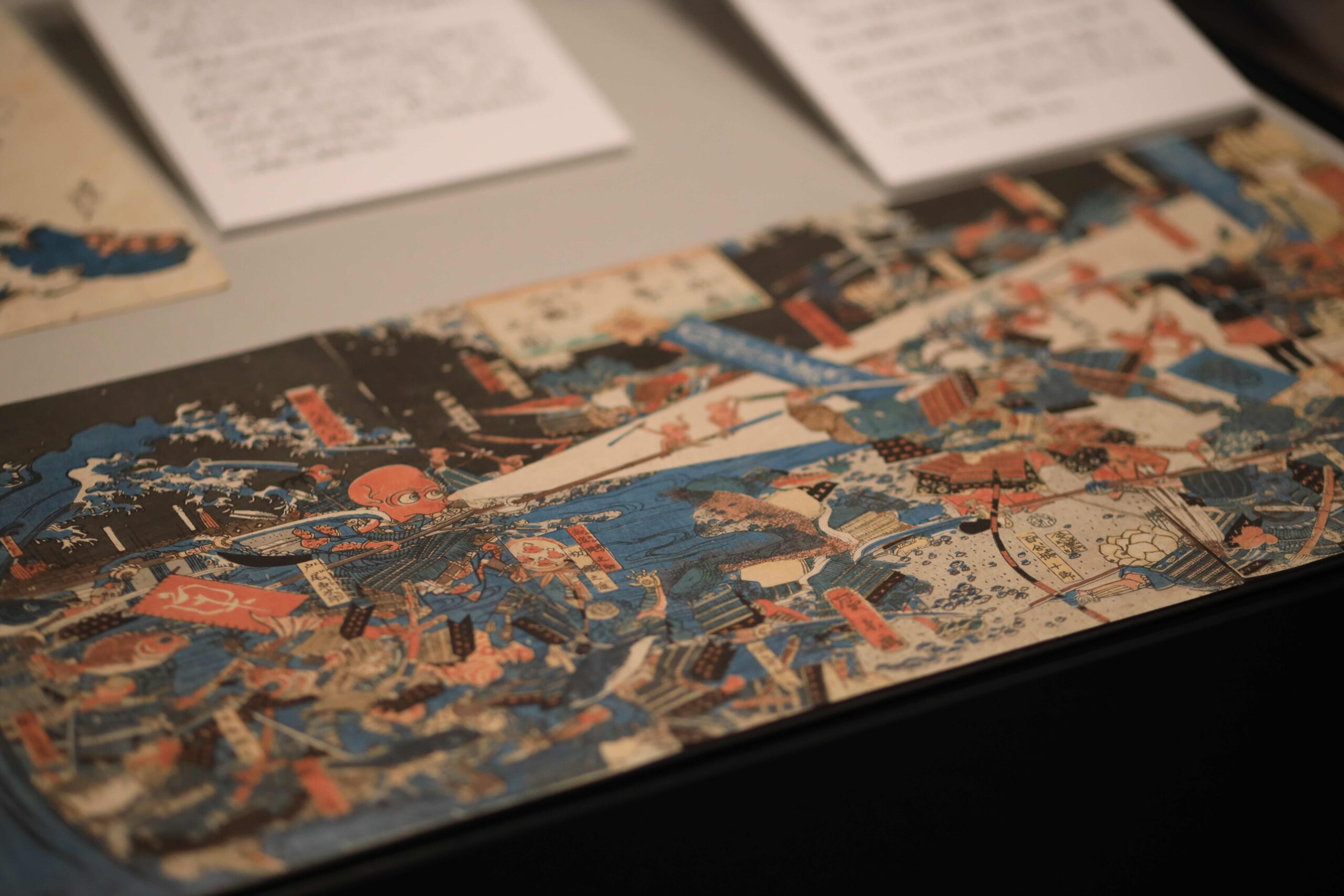 Main exhibition hall at the Sakamoto Ryoma Memorial Museum with visitors exploring displays