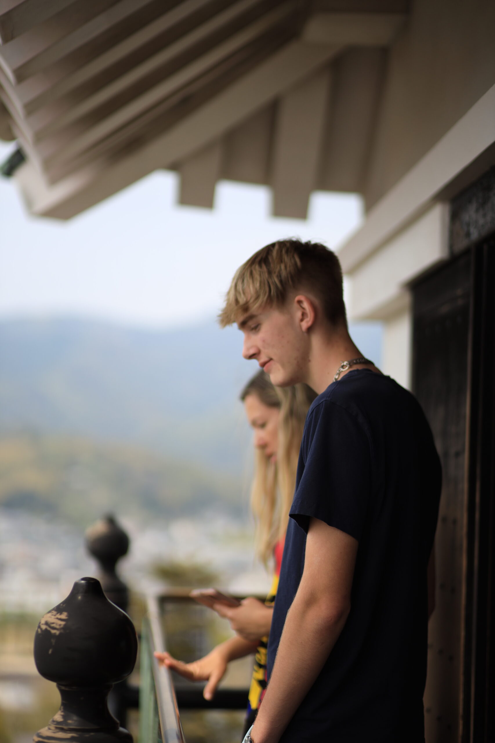 Mother and son gazing at castle view