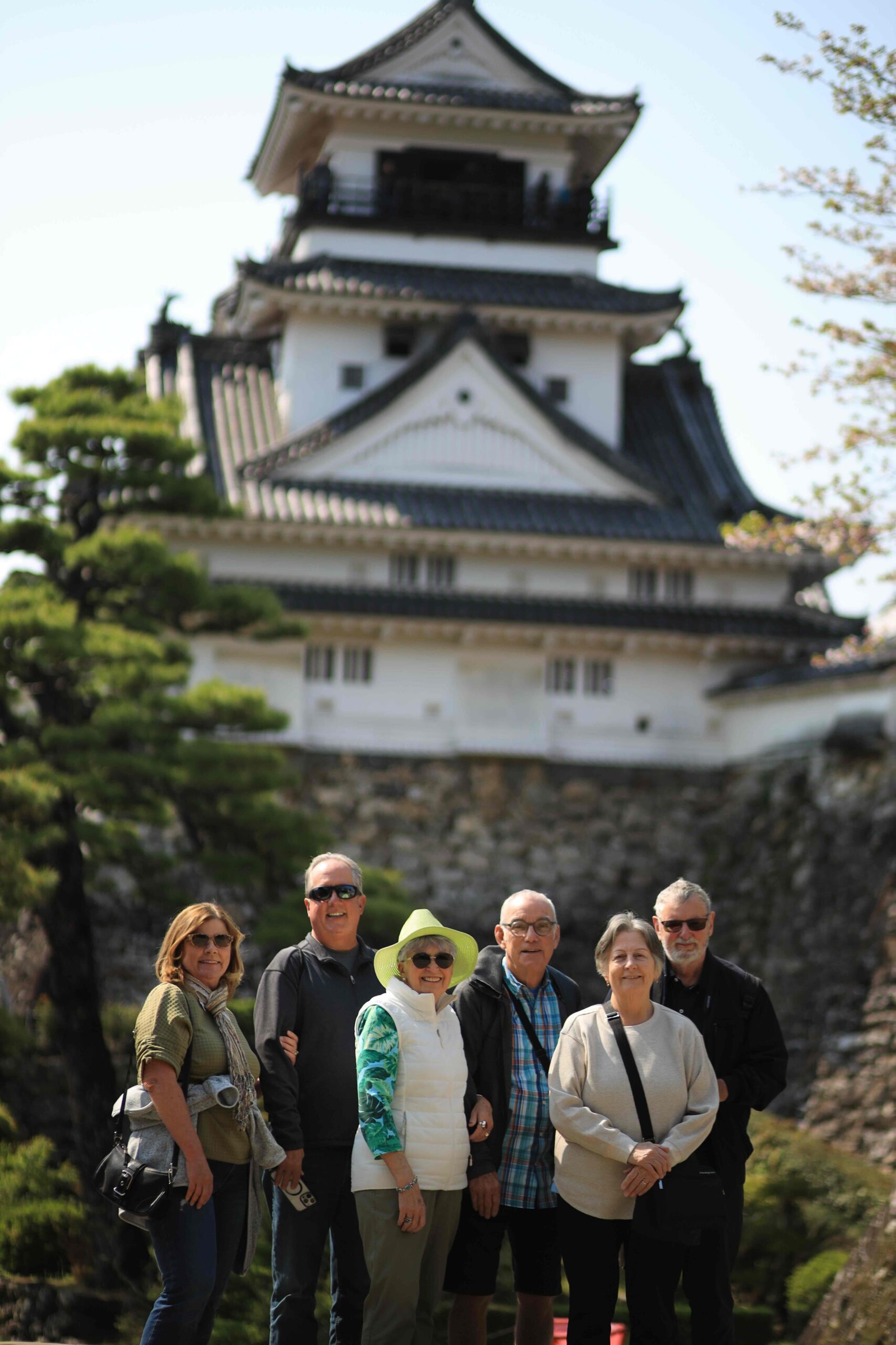Tour guests in front of Kochi Castle keep on a private cruise shore excursion