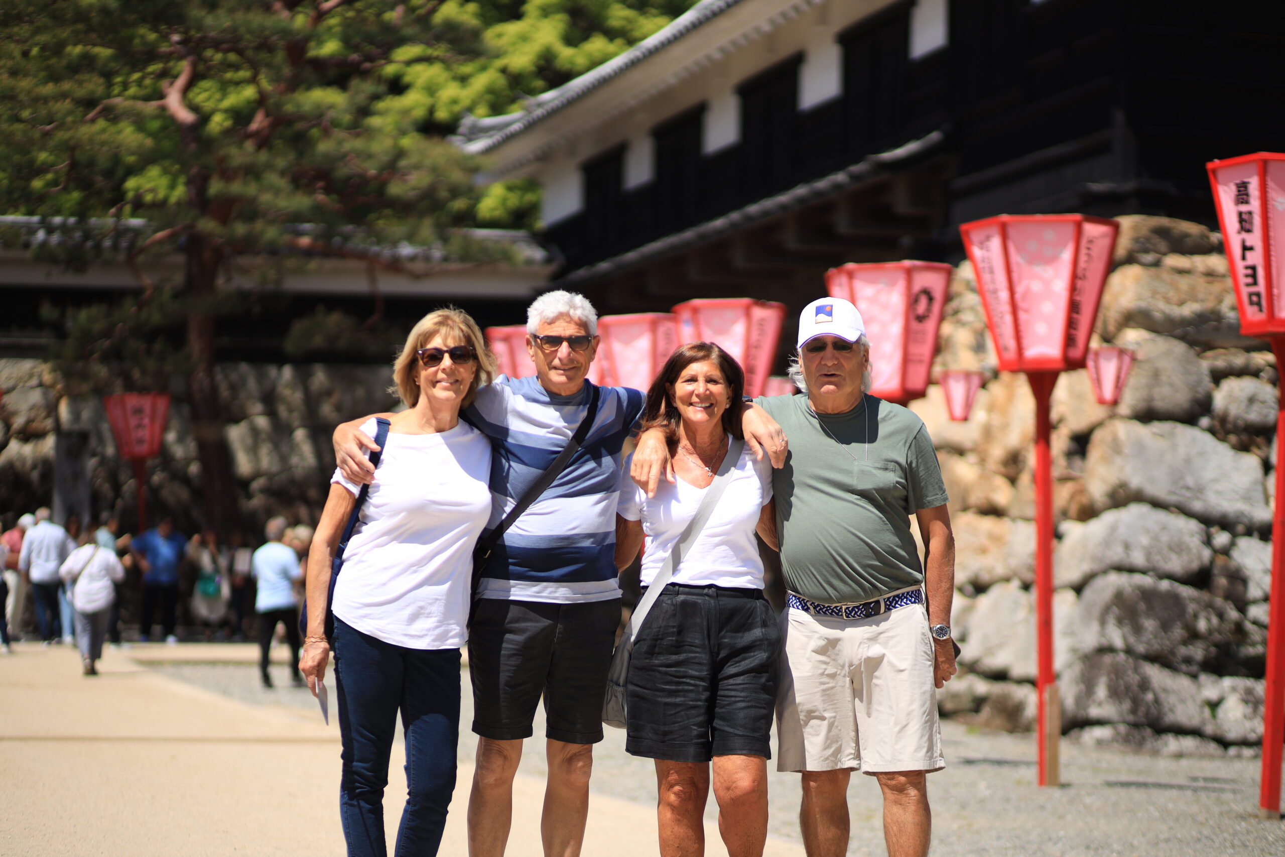 Visitor climbing traditional wooden castle stairs