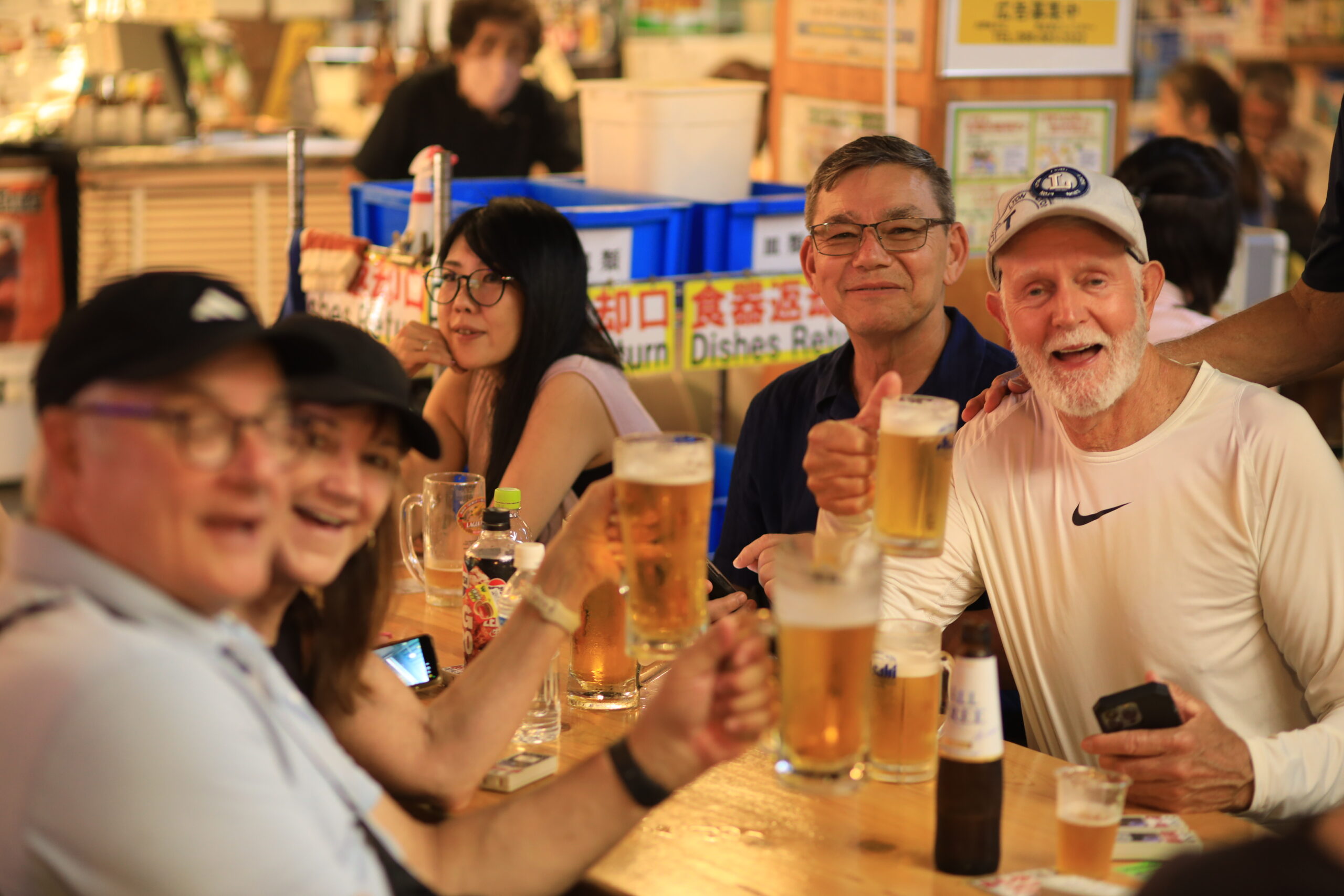 Guests enjoying Hirome Market with beer
