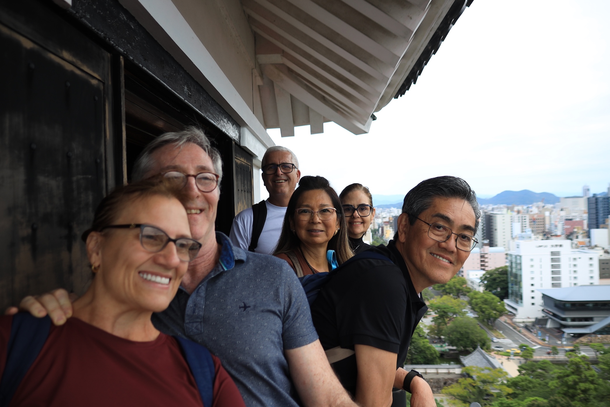 Tour guests at Kochi Castle with panoramic city views