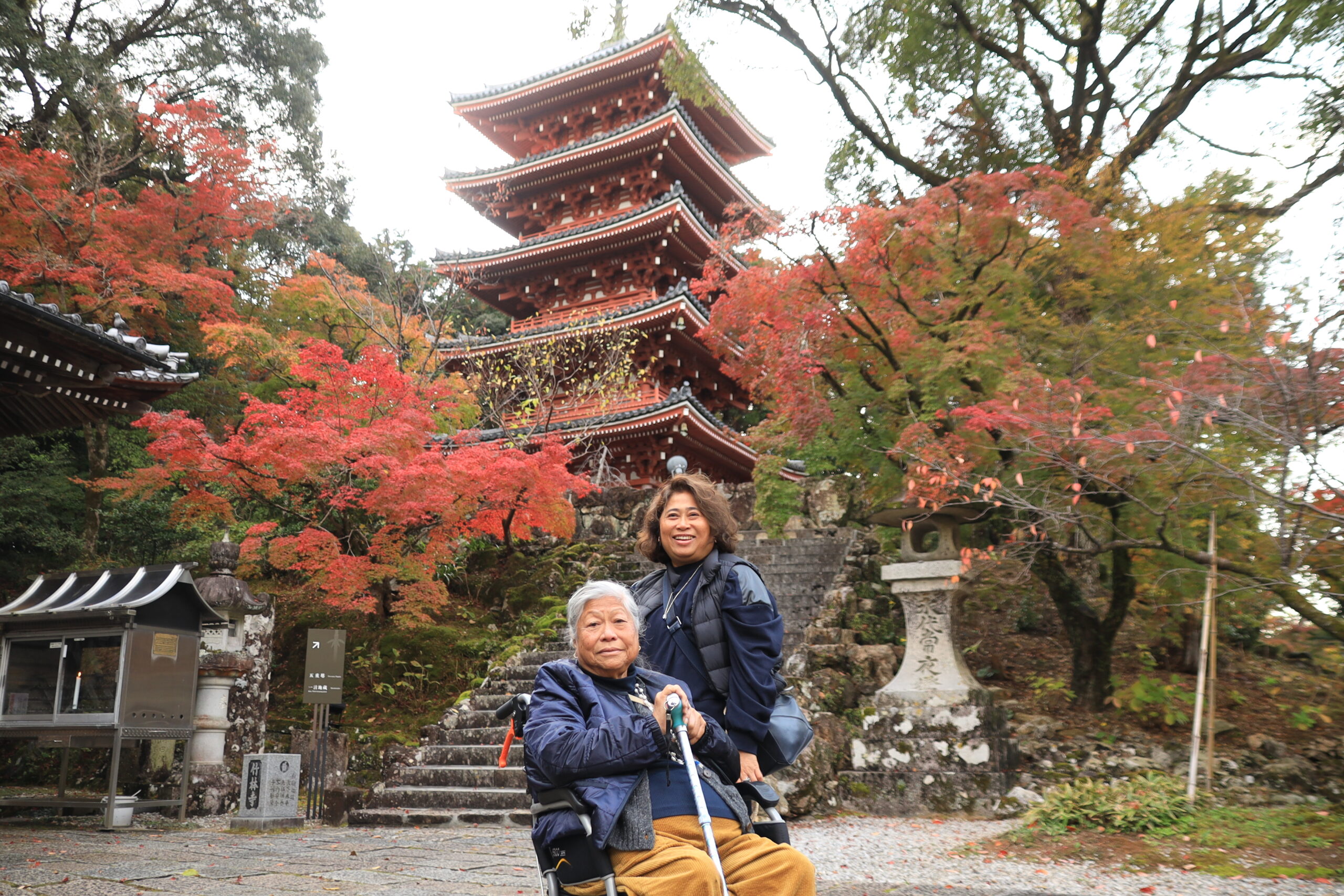 Family photo at Chikurinji five-story pagoda with autumn colors
