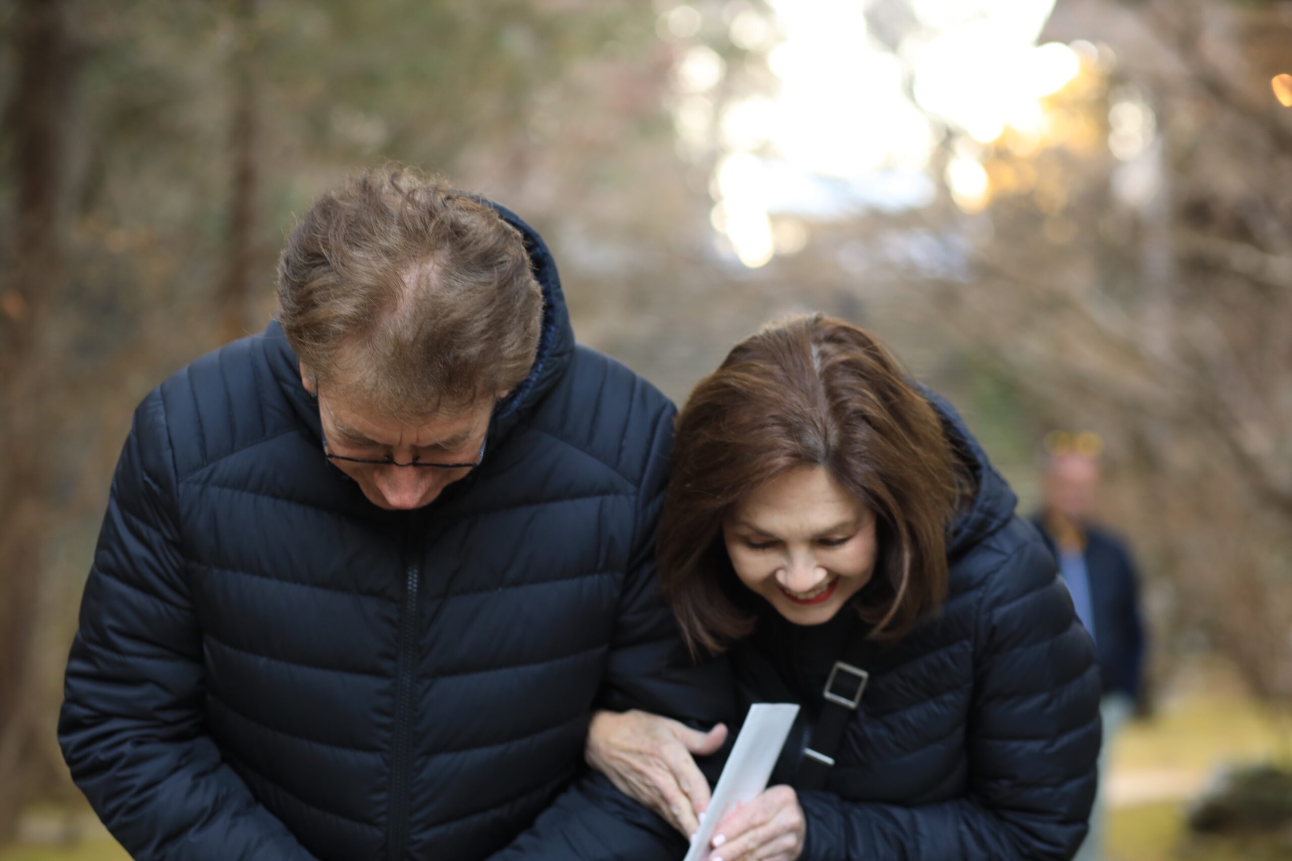 Guests walking through Makino Botanical Garden autumn trees