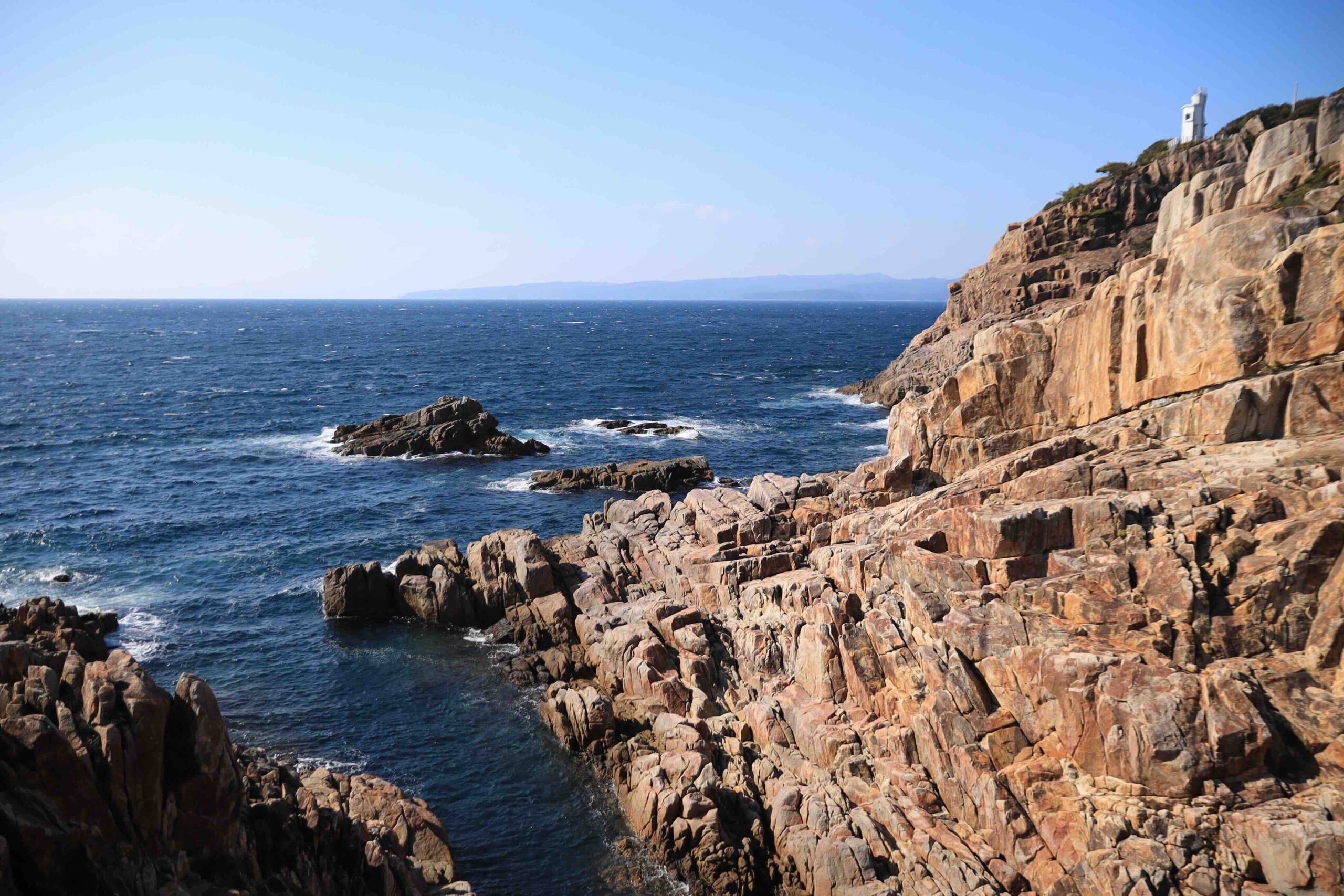 Close view of the steep rocky hillside leading to the shrine at Cape Ashizuri