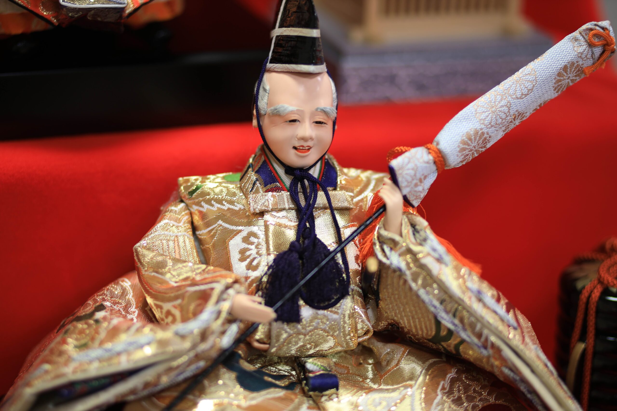 Court musician doll from the gonin bayashi group playing a drum