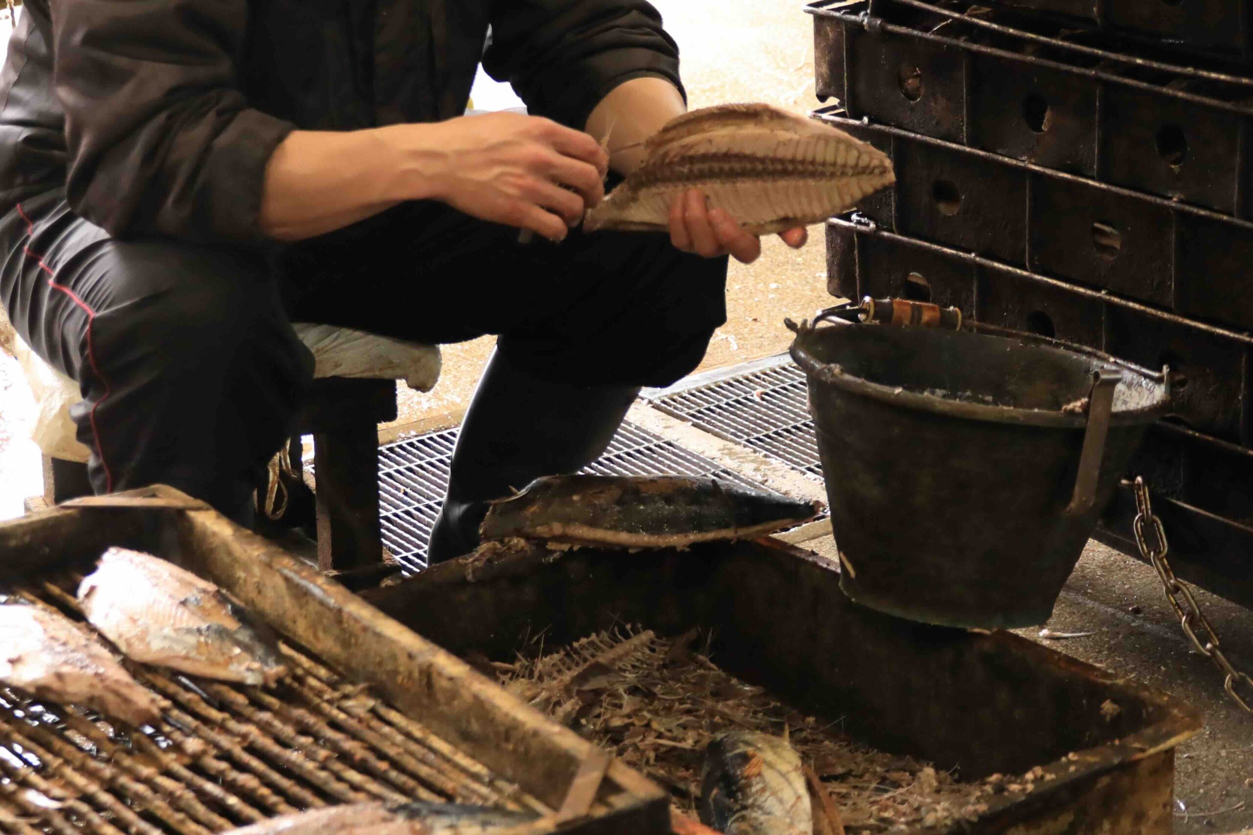 Demonstrating how to shave dried bonito at Takeuchi Shoten