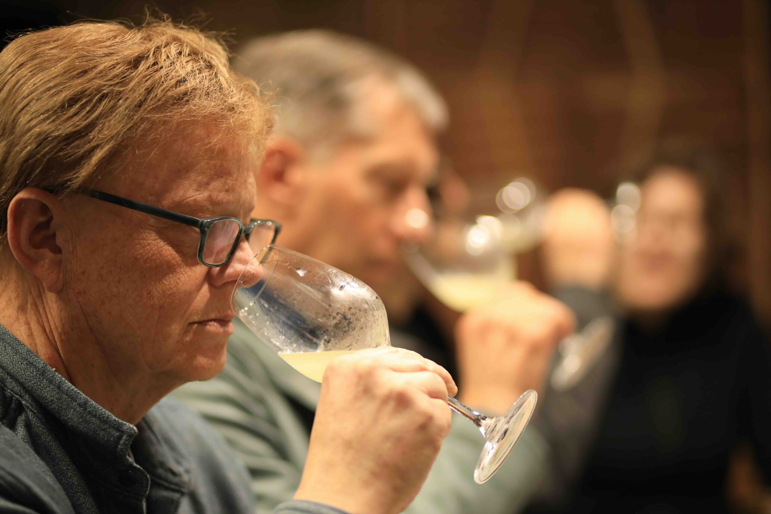 Guests tasting sake at Kameizumi Brewery