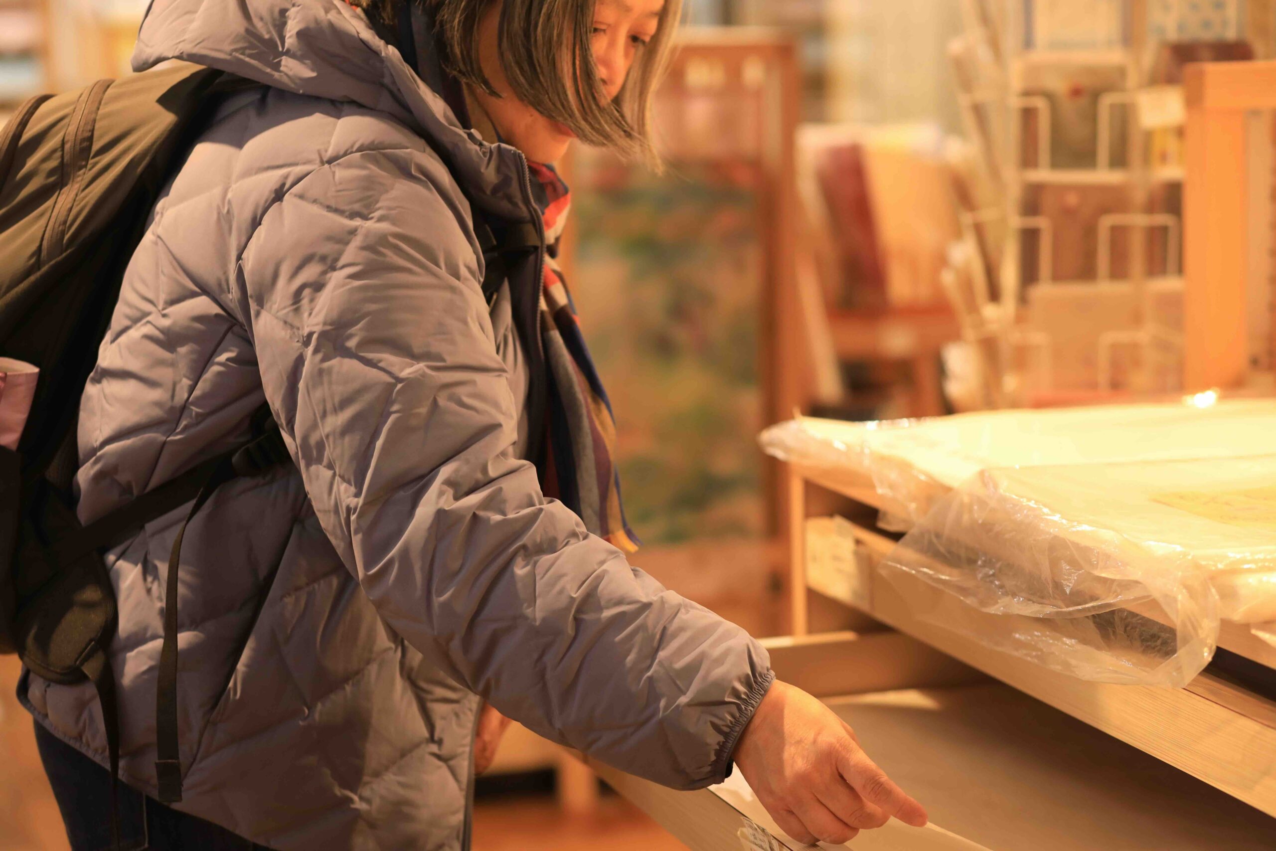 Guest browsing washi paper products at the museum shop in Kochi
