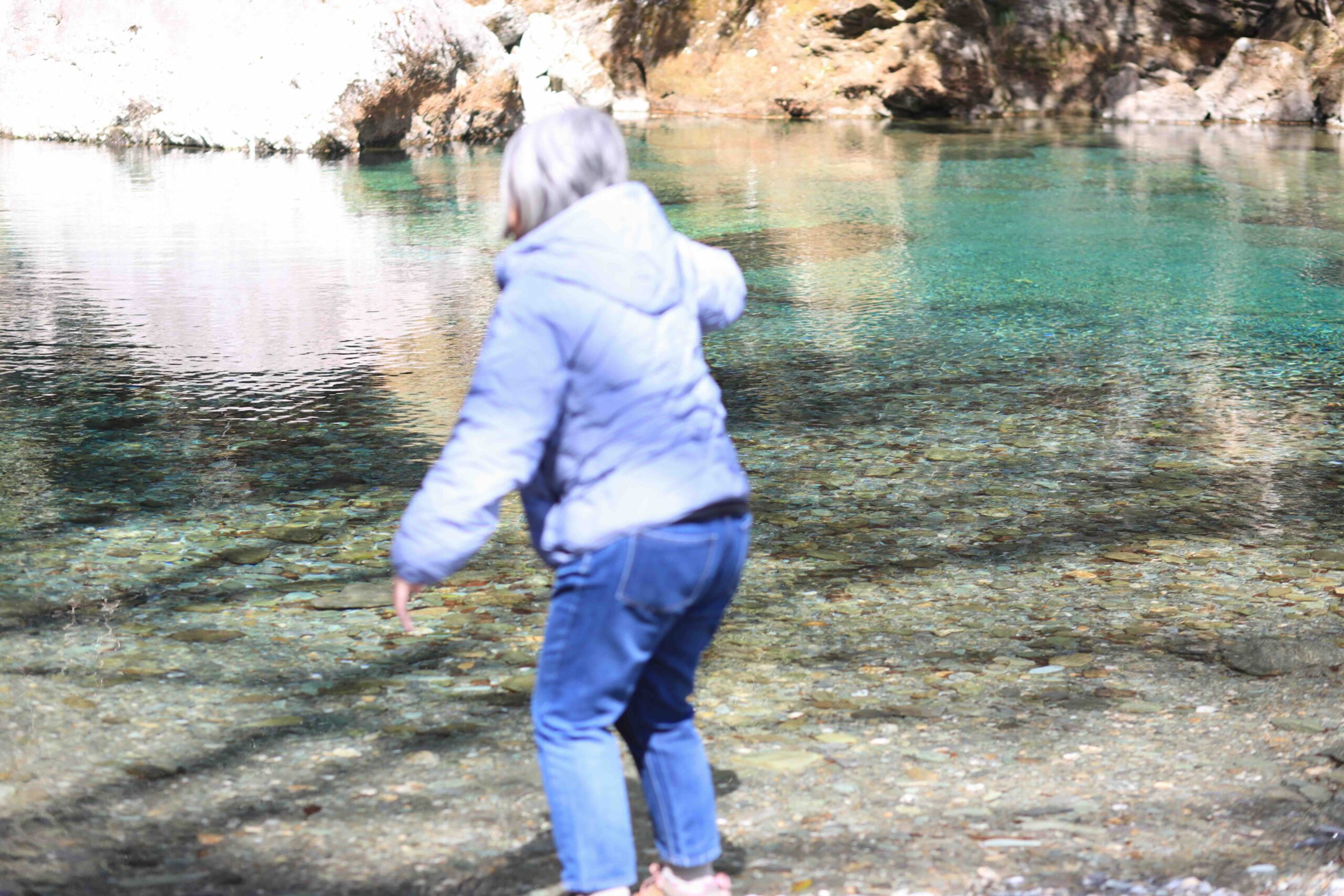 Guest stepping into the Niyodo Blue river at Yasui Valley Kochi