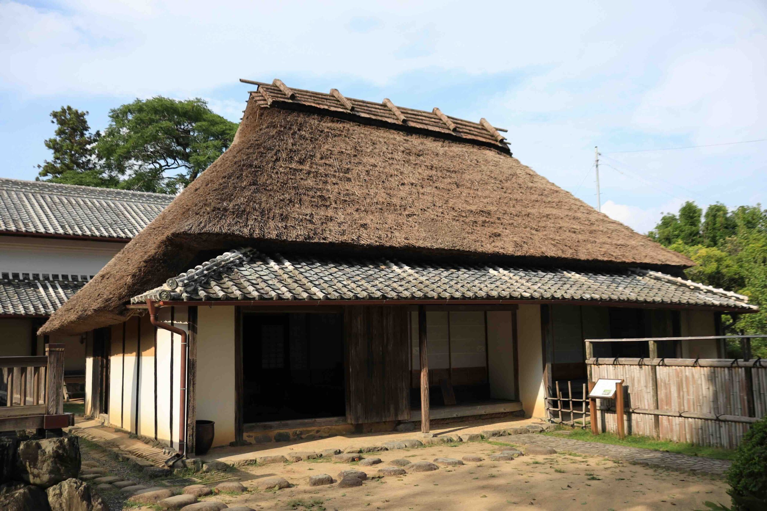 Side view of the thatched main building at the Iwasaki Yataro birthplace in Aki City Kochi
