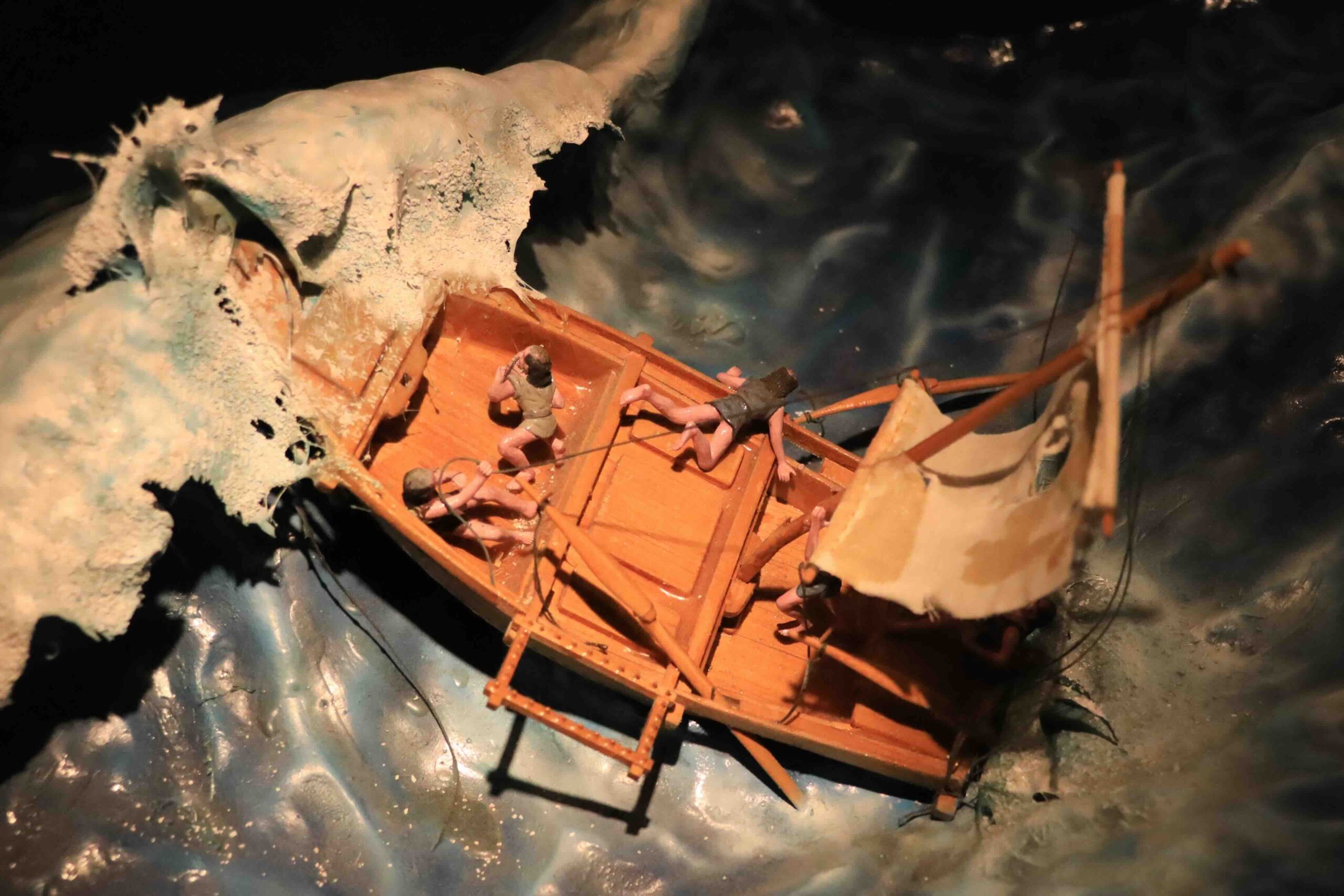 Diorama showing Manjiro and companions in a small boat being tossed in storm waves at the John Mung Museum Kochi