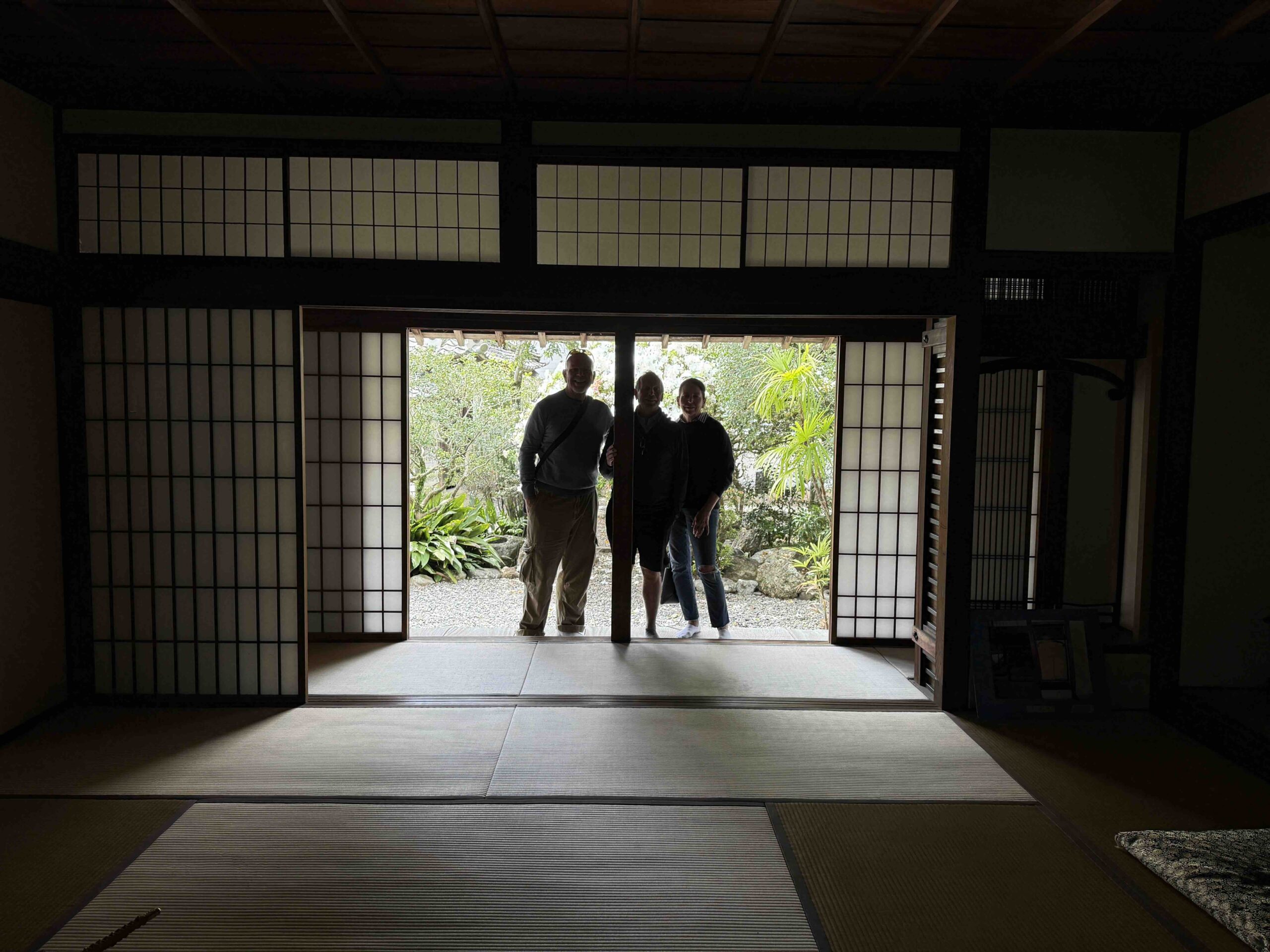 Guests silhouetted in the doorway of a samurai residence tatami room in Okawasuji