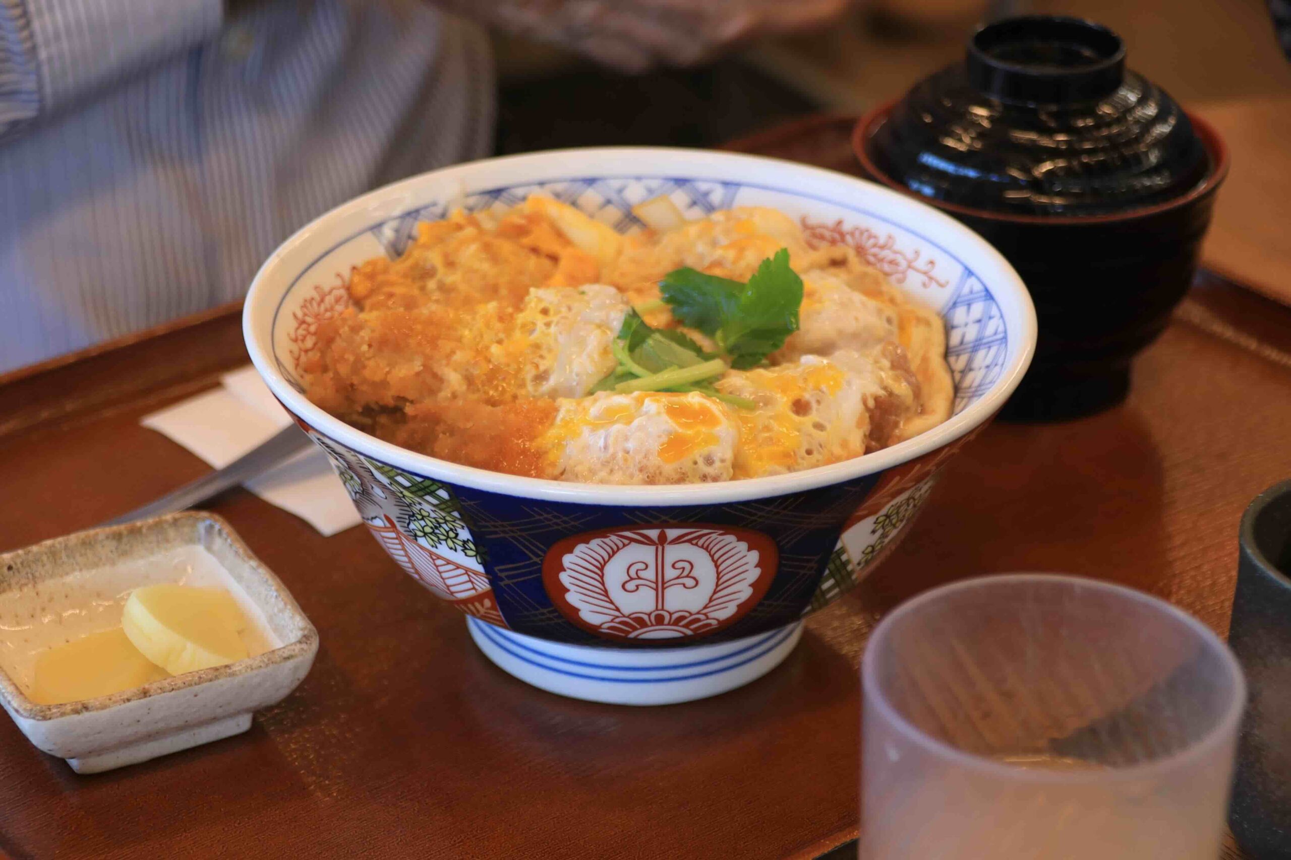 Katsu-don pork cutlet rice bowl served in a traditional Japanese ceramic bowl at Hareta restaurant in Tosa City