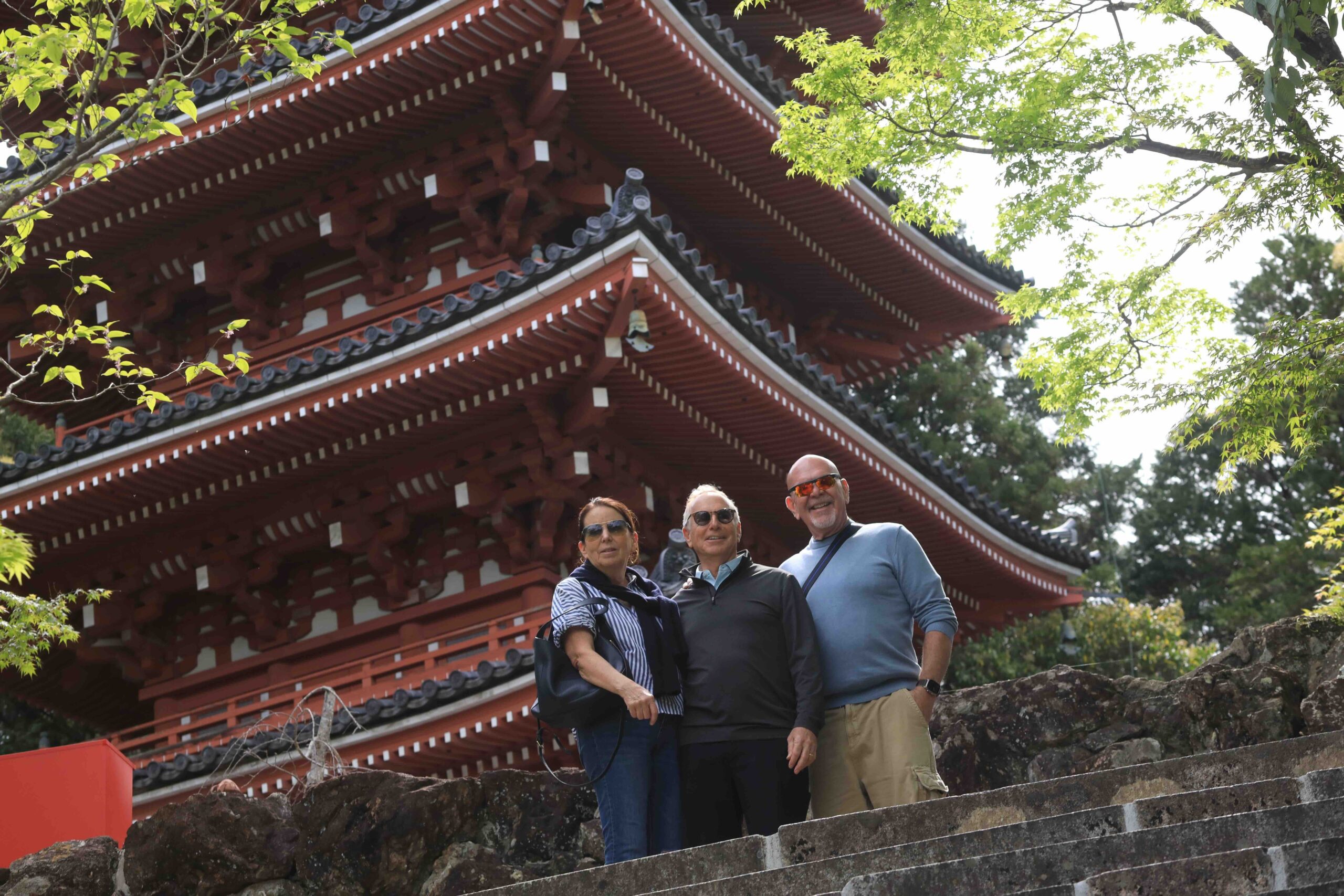 Three guests in front of the five-story pagoda at Chikurinji Temple in Kochi