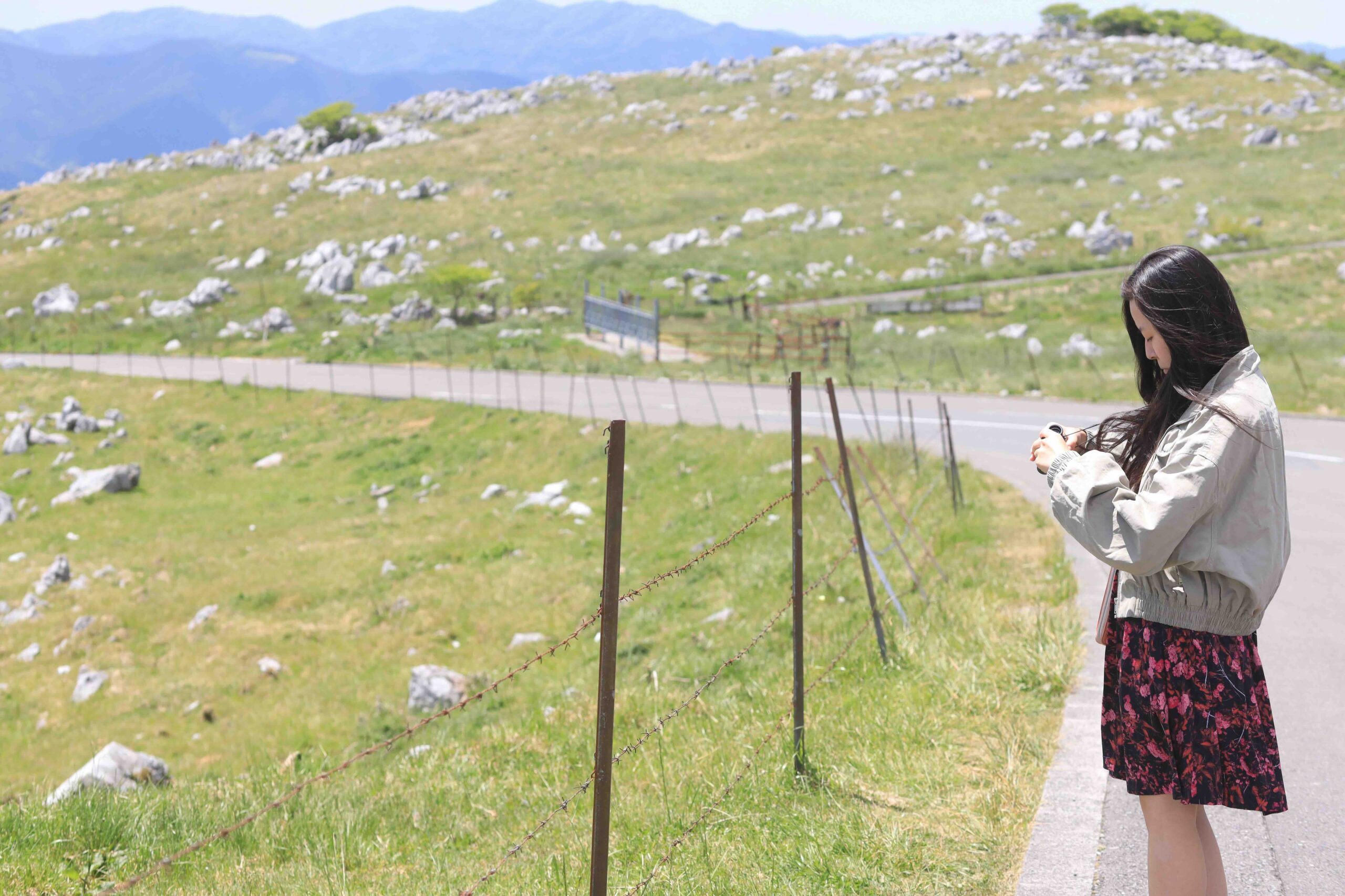 Visitor at Tengu Highlands Shikoku Karst plateau with limestone landscape in Kochi Japan