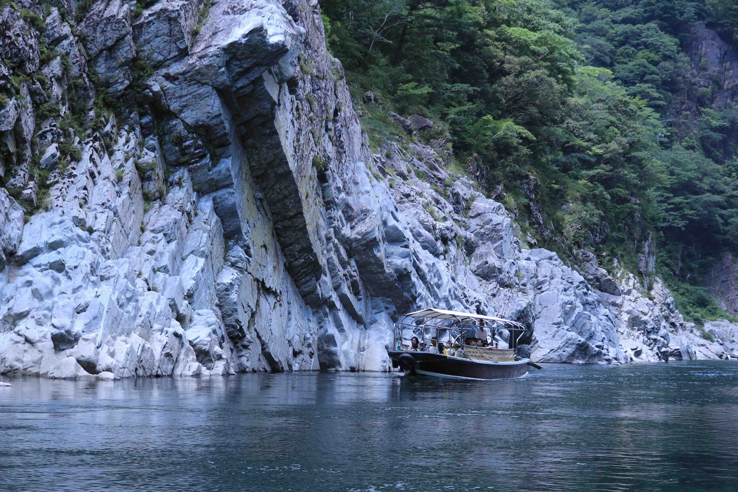 Sightseeing boat cruising through Oboke Gorge on the Yoshino River